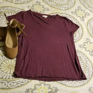 Cupio Maroon v-neck with crisscross detail.